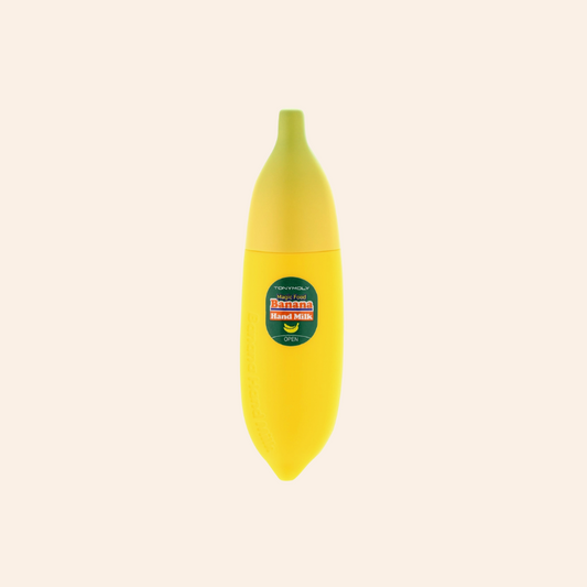 Yellow banana-shaped container with a label on a beige background